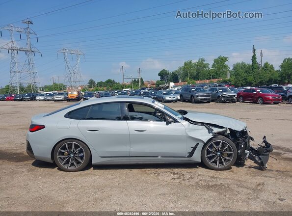 WBY43HD07TFW37968 2026 BMW I4 Turquoise Սալոնի հետևի տեսք