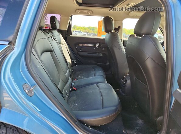 WMWLU5C51J2G03387 2018 MINI COOPER Blue Vista de los asientos traseros