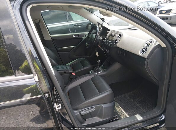 WVGAV7AX2GW569042 2016 VOLKSWAGEN TIGUAN Black Front interior view