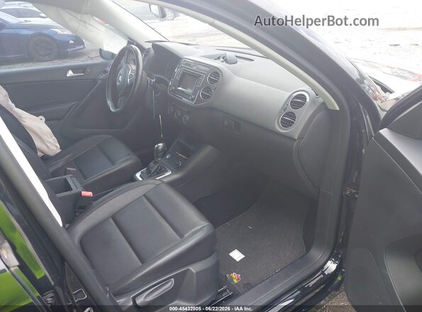 WVGAV7AX7GW581011 2016 VOLKSWAGEN TIGUAN Black წინა სალონის ხედი