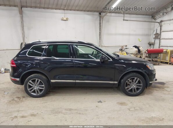 WVGEF9BP6GD001543 2016 VOLKSWAGEN TOUAREG Black Vista interior trasera