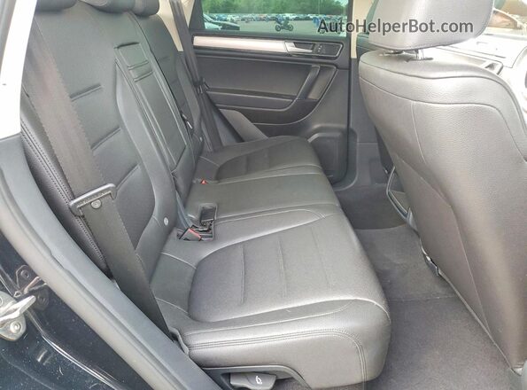 WVGEF9BP8GD010440 2016 VOLKSWAGEN TOUAREG Black Vista interior trasera