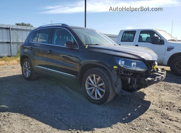WVGRV7AX9HK019574 2017 VOLKSWAGEN TIGUAN Black Front right