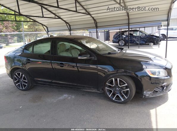 YV140MTLXH2427873 2017 VOLVO S60 Black Vista interior trasera