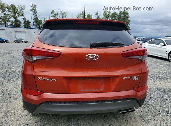 KM8J3CA21GU077326 2016 HYUNDAI TUCSON Оранжевый Вид салона спереди