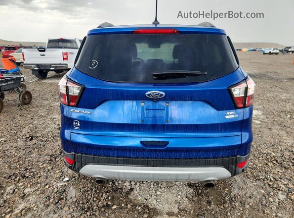 1FMCU9HD7JUB10482 2018 FORD ESCAPE Синий Вид салона спереди