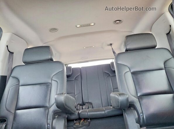 1GNSKHKC7KR395180 2019 CHEVROLET SUBURBAN Серебряный Вид задней части салона