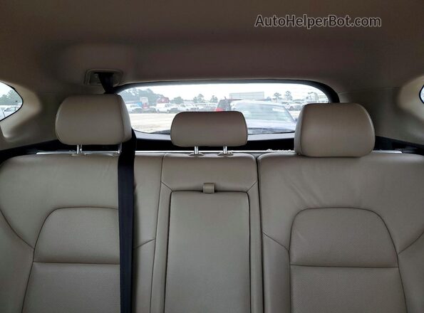 KM8J33A23GU268603 2016 HYUNDAI TUCSON White Rear interior view