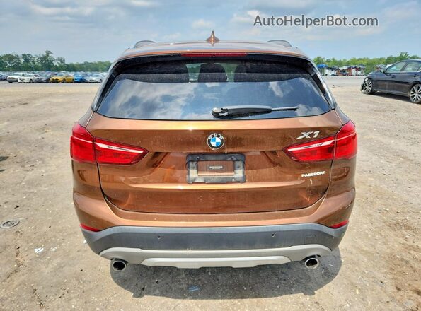 WBXHU7C3XH5H32940 2017 BMW X1 Brown Вид салону спереду