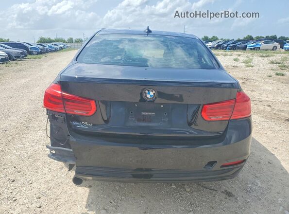 WBA8E1G3XHNU17695 2017 BMW 3 SERIES Black Front interior view