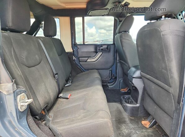 1C4BJWDGXGL207228 2016 JEEP WRANGLER Gray Widok tylnych siedzeń