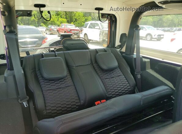 1C4GJXAN0PW571963 2023 JEEP WRANGLER Фиолетовый Вид задней части салона