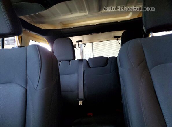 1C4HJXDN3KW573473 2019 JEEP WRANGLER Yellow Rear seats view