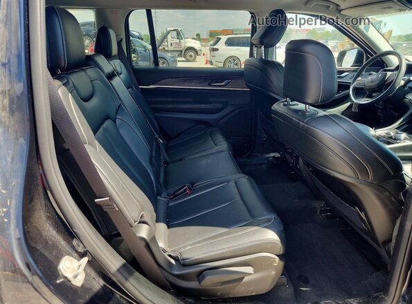 1C4RJKBG6P8876707 2023 JEEP GRAND Blue Rear interior view