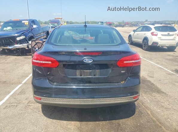 1FADP3F24JL218262 2018 FORD FOCUS Black Rear view