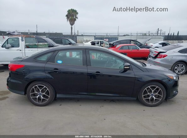 1FADP3H20JL270548 2018 FORD FOCUS Черный Вид задней части салона