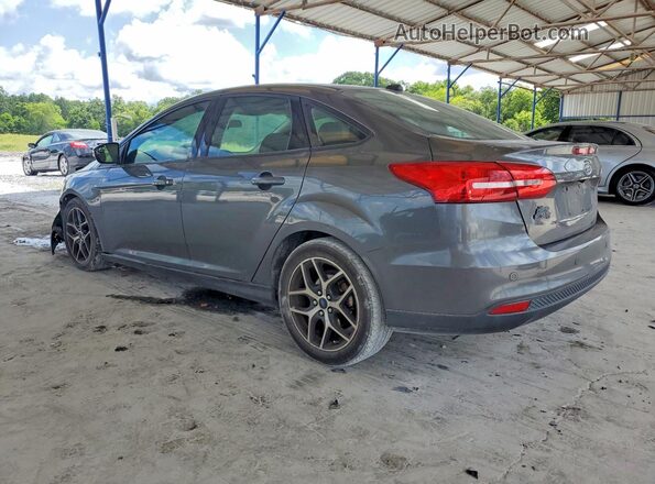 1FADP3H25JL256127 2018 FORD FOCUS Charcoal Trasero izquierdo