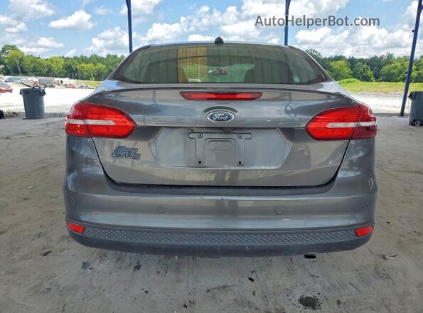 1FADP3H25JL256127 2018 FORD FOCUS Charcoal Vista trasera