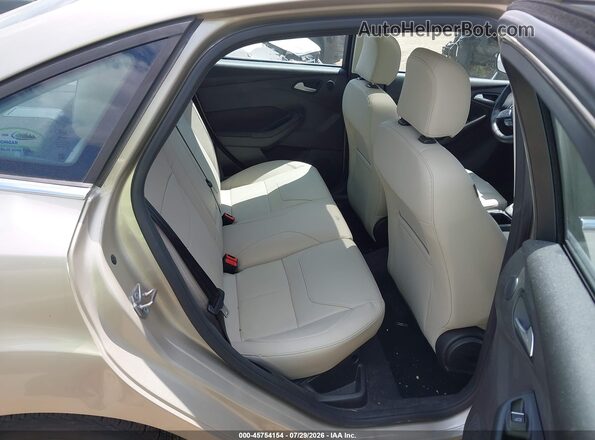 1FADP3J23HL203706 2017 FORD FOCUS Gold Вид наклейки з VIN-кодом