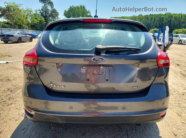 1FADP3M2XHL323174 2017 FORD FOCUS Серый Вид сзади