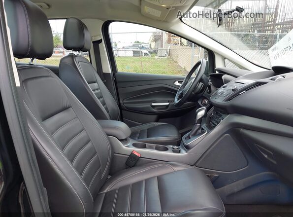 1FADP5EU7HL106838 2017 FORD C-MAX ENERGI Black Front interior view