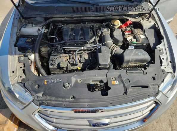 1FAHP2E88GG134075 2016 FORD TAURUS Silver Vista interior trasera