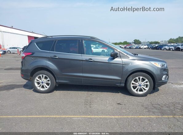 1FMCU0G90JUC63598 2018 FORD ESCAPE Gray Vista interior trasera