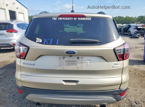 1FMCU0GD0HUD26634 2017 FORD ESCAPE Gold Rear view