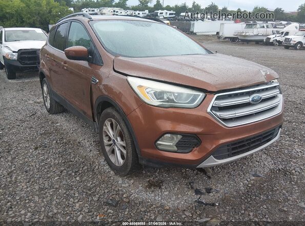 1FMCU0GD3HUA57576 2017 FORD ESCAPE Оранжевый Вид панели приборов