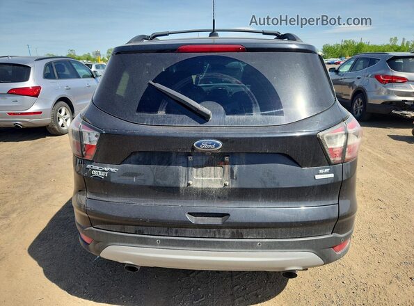 1FMCU0GD4HUA16759 2017 FORD ESCAPE Black Rear view