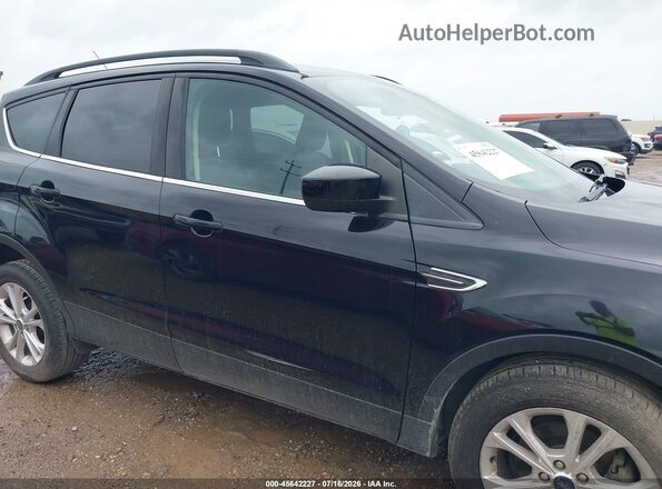1FMCU0GD8JUD02300 2018 FORD ESCAPE Black Widok wnętrza z tyłu