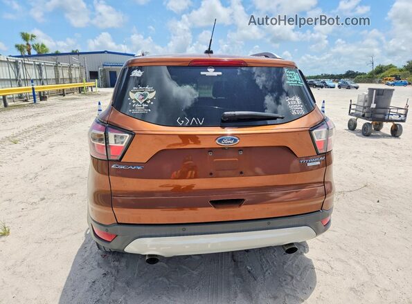 1FMCU0J91HUB74383 2017 FORD ESCAPE Оранжевый Вид сзади