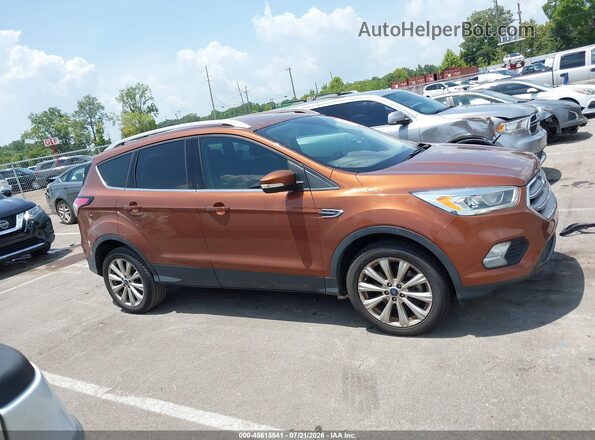 1FMCU0J97HUE42840 2017 FORD ESCAPE Orange Widok wnętrza z tyłu