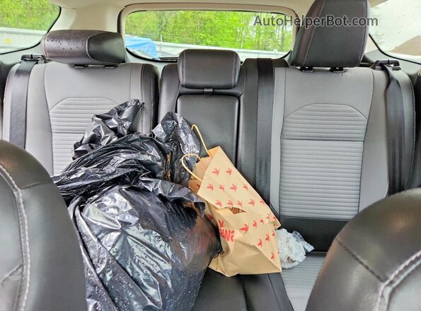 1FMCU9GD2JUB34450 2018 FORD ESCAPE Black Rear seats view