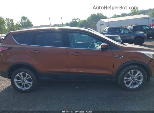 1FMCU9GD7HUA57133 2017 FORD ESCAPE Brown Սալոնի հետևի տեսք