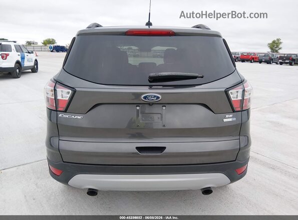 1FMCU9GD7JUD31176 2018 FORD ESCAPE Gray 
