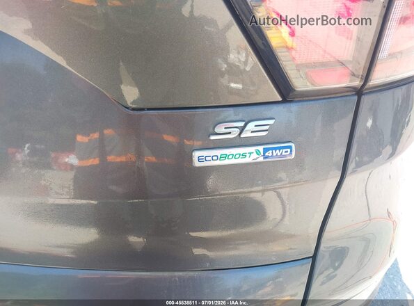 1FMCU9GD9JUD08563 2018 FORD ESCAPE Серый Вид задней части салона