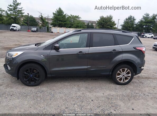 1FMCU9HD3JUD54016 2018 FORD ESCAPE Gray Vista interior trasera