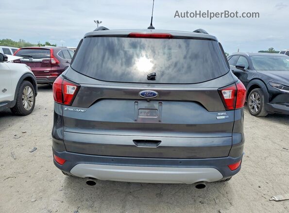 1FMCU9HD5KUA77659 2019 FORD ESCAPE Gray Rear view