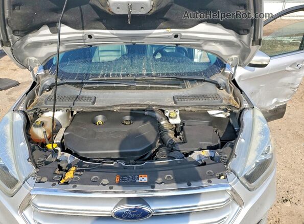 1FMCU9J94HUB13114 2017 FORD ESCAPE Серебряный Вид задней части салона