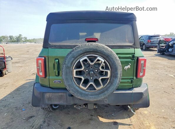 1FMDE5DH5PLA99404 2023 FORD BRONCO Зеленый Вид салона спереди