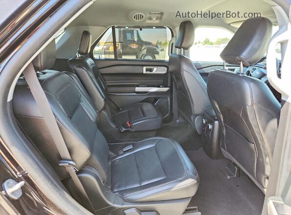1FMSK7FH9PGB20174 2023 FORD EXPLORER Black Vista interior trasera