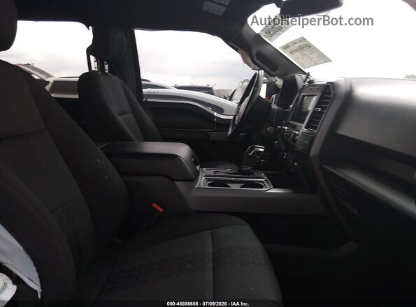 1FTEW1E40LKE79759 2020 FORD F150 Серый Вид салона спереди