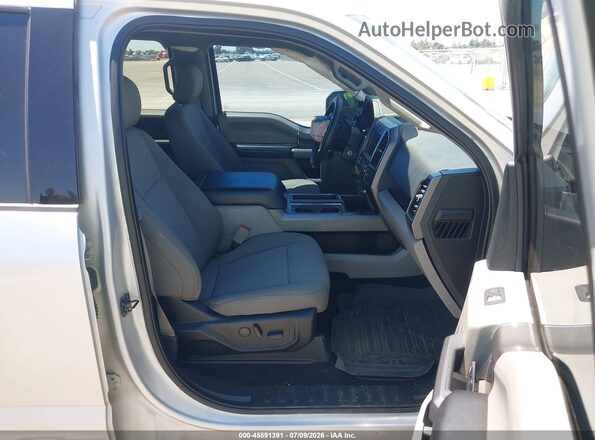 1FTEW1E48KKD28795 2019 FORD F150 Серебряный Вид салона спереди