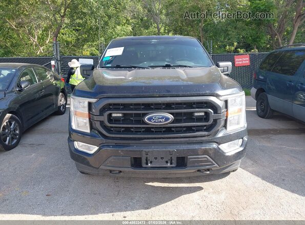1FTEW1EP2NKD65744 2022 FORD F150 Black Widok wnętrza z tyłu