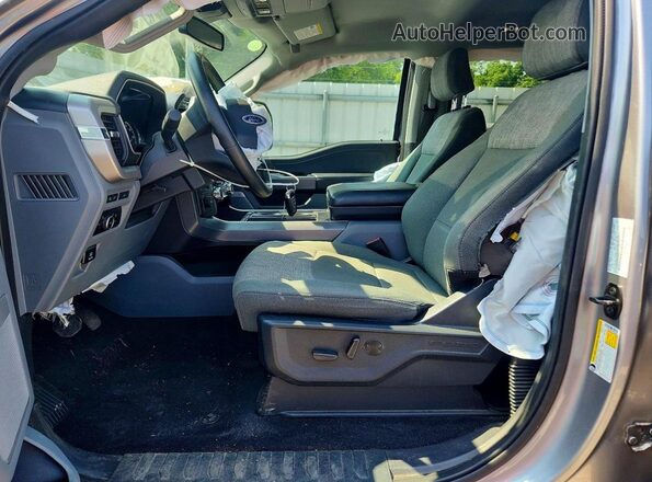 1FTFW1E87PFD30982 2023 FORD F150 Серебряный Вид салона спереди