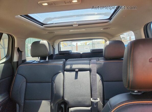 1GKKNLLS6PZ206104 2023 GMC ACADIA Blue Widok tylnych siedzeń