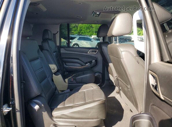 1GKS2HKJ8LR100665 2020 GMC YUKON Black Widok wnętrza z tyłu