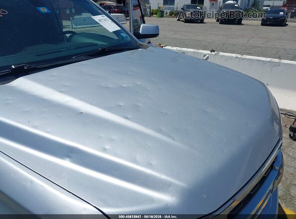 1GNSCAEC1KR101787 2019 CHEVROLET TAHOE Silver Widok wnętrza z tyłu