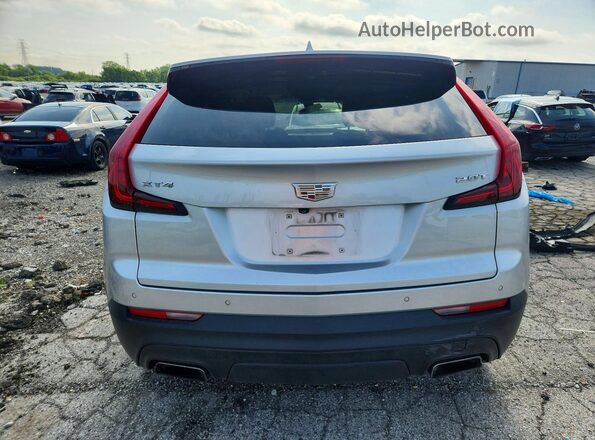 1GYAZAR47KF146962 2019 CADILLAC XT4 Silver Widok z tyłu